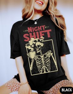 "Comfort Colors Coffee Skeleton Night Shift Shirt, Funny Night Shift Nurse Shirt, Funny Skeleton Costume, Night Shifter Nurses Shirts, New Nurse Gift, Emergency Department Shirt, Nurse Practitioner Tee ✧ WHY  YOU'LL  LOVE IT ✧  ⋒ Comfort Colors® tees are garment-dyed shirts that are timeless classics and will never pile.  ⋒ Trendy retro vintage look and gorgeous colors.  ⋒ Amazingly soft and comfy. Perfect with any shorts, skirts, jeans, leggings, or nothing but undies around the house. ⋒ Create Graphic Print Crew Neck Sleepwear, Crew Neck Graphic Print Sleepwear, Graphic Print Crew Neck Sleepwear For Bedtime, Graphic Print Sleep Tops With Crew Neck, Graphic Print Crew Neck Top For Sleep, Crew Neck Sleep Top With Graphic Print, Graphic Print Short Sleeve Bedtime Top, Black Graphic Print Short Sleeve Sleepwear, Black Short Sleeve Sleepwear With Graphic Print