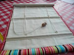 a piece of cloth is laying on top of a table with an object in the middle