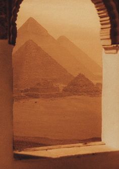 an old photo of the great pyramids in egypt, taken from inside a building