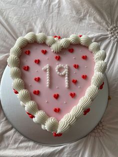 a heart shaped cake with the number 11 on it