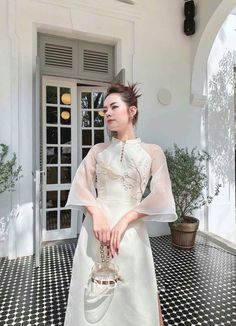 🌿 This set includes traditional Ao Dai, white pants. Style: Modern Material: Very well made with high-quality silk Collar: traditional collar Please provide bust-waist-and hip measurements when placing your order to ensure the best fit for you. 🌿 NOTE: * Recommend gentle washing * Please contact us for any inquiries about size. We don't have an exchange policy for the wrong size * It is safe for a washer and dryer in a "delicate" setting. * Actual Ao Dai colors may differ up to 10% due to lightning and viewing devices. * These ao dai pants are made based on Vietnamese size; they will run smaller than American size. *3D printed ao dai: you may see some white broken fabric around the seam (collar). *There might be some chalk/ pen writings on the fabric because it is brand new, unwashed ao Ao Dai White, Unique Designers, White Pants, Favorite Dress, Dress Clothes For Women, Silk Dress, Fashion Pants, Set Dress, Red Dress