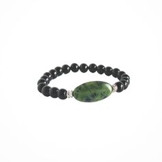 This Power Stone Bracelet is made with gorgeous, all natural, Green Jade and Black Onyx. This stone has been revered for centuries as a symbol of serenity and purity as well as a talisman for good luck and abundance. It has also been called a "dream stone" and said to bring the wearer insightful dreams. Chakra: HeartSignificance: 12th Anniversary gemstone Materials include: 15x30mm natural, high-quality Green Jade focal stone 8mm natural, high-quality Black Onyx stones zinc-alloy, silver colored metal accent beads strong stretch cord Note: Crystal descriptions are meant to support healing, not to provide prescription or healthcare information. Onyx Gemstone Beads Jewelry For Healing, Onyx Bead Jewelry For Healing, Spiritual Obsidian Round Bead Jewelry, Spiritual Obsidian Jewelry With Round Beads, Spiritual Onyx Jewelry With Gemstone Beads, Spiritual Stretch Bracelet With Natural Stones, Everyday Spiritual Stretch Bracelet With Natural Stones, Spiritual Jade Beaded Bracelets For Everyday, Hand-strung Obsidian Bracelet