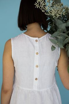 "MsWrinkle's clothing - from human to human. 100% handmade. *Description* - Sleeveless smock/maternity dress with pockets and buttons on back ; - High quality European linen; - Washed and softened (doesn't shrink anymore); - Medium weight linen (150 g/m2); - Our linen is OEKO-TEX certified that meets human ecological safety requirements; - Model is wearing size S in white color (other sizes and colors please choose on the right); - Slightly transparent; - Not ironed and we suggest to use tumble Sleeveless Cotton Dress With Button Back, Summer Linen Button Dress, Summer Linen Dress With Buttons, Casual Sleeveless Linen Dress With Buttons, Sleeveless Linen Dress With Button Closure, Sleeveless Linen Dress With Buttons For Spring, Beach Linen Dress With Buttons, White Sleeveless Linen Dress With Pockets, Sleeveless Linen Dress With Buttons For Daywear