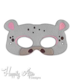 a gray mask with pink ears on it's face and eyes are drawn in the shape of a bear