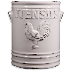 a white ceramic pot with a rooster on the side and words utensils written in large letters