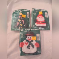 three plastic bags with christmas decorations on them