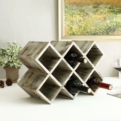 a wooden wine rack holding several bottles of wine