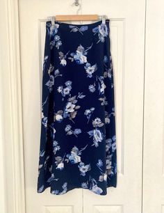 Vintage 'Hana' Floral Navy Midi Skirt 🦋 Size 12 - small fit  Made from polyester. Side zip and darts in the back for a flattering fit ✔️ Measurements: 36cm across waist x 97cm length  Some minor imperfections, as expected with its age.  Please view photos carefully before purchasing. This item will be carefully gift wrapped and posted in a satchel to ensure that your order arrives safely. Add additional items to your basket and pay only $3 extra for postage per item. Retro Womens Fashion, Navy Midi Skirt, Retro Fashion Women, Black Midi Skirt, Black Midi, Skirt Outfits, Blue Flowers, Midi Skirt, Size 12