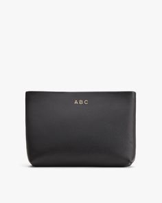 A companion for your everyday bag to keep your necessities organized and secure. Pair it with our totes or wear it alone as a clutch. Modern Rectangular Pouch For On-the-go, On-the-go Laptop Sleeve Pouch Bag, Classic Black Pouch Bag, Modern Black Crossbody Pouch, Versatile Black Cosmetic Bag For Travel, Classic Everyday Rectangular Travel Accessories, Rectangular Zipper Pouch Travel Case For On-the-go, Classic Pouch Bag With Zipper Closure, Black Leather Clutch With Zipper Pouch