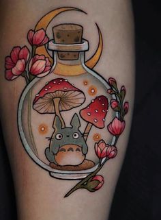 a tattoo with a bottle and mushrooms in it