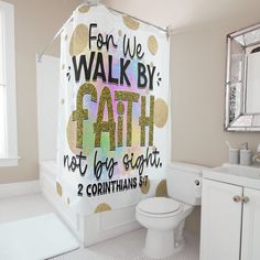 a bathroom with a shower curtain that says, for we walk by faith not for sight