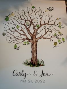 a wedding guest book with a tree drawn on it