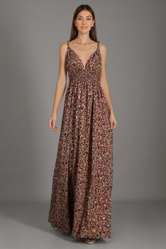 The Elise Pink Floral Maxi Dress features a plunging V-neckline and a pleated detail at the waist, paired with a voluminous floor-length skirt. The perfect style for your next special occasion. Flowy V-neck Lined Maxi Dress, Evening V-neck Maxi Dress With Smocked Back, Floral Print Maxi V-neck Party Dress, Flowy Smocked Bodice Maxi Dress For Evening, Flowy Maxi Dress With Smocked Bodice For Evening, Bohemian Party Dress With Smocked Back, Elegant Party Maxi Dress With Smocked Bodice, Ruched Empire Waist Maxi Dress For Party, Party Maxi Dress With Smocked Back, Floor-length