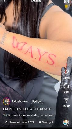 a woman with tattoos on her arm and the words days written in red ink behind her arm