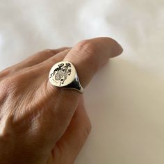 "Coat of Arms Family Crest Ring, Crest Engraved ring, Personalized Ring Engraved Signet ring with Round Seal - Best quality 18k Gold Plate also avaliable in sterling silver - suitable for men and women, Diameter: 15 mm  Please note in the \"notes to seller\" at checkout. : * state your ring size  * letter/ picture you want to engrave The product will arrive to you packed in gift box and padded envelope to maintain the product Our jewelry are water resistant and comes with 1 year warranty For more rings from us: https://www.etsy.com/il-en/shop/Limajewelry?section_id=16284797&ref=shopsection_leftnav_1  Thank you for your interest. Please check out our other items and be sure to add us to your favorites! https://www.etsy.com/shop/Limajewelry We look forward to the opportunity of serving you." Adjustable Symbolic Signet Ring For Anniversary, Personalized Adjustable Symbolic Signet Ring, Adjustable Symbolic Personalized Signet Ring, Adjustable Personalized Symbolic Signet Ring, Engraving Option Open Ring Jewelry Gift, Wedding Adjustable Stamped Signet Ring, Engraved Ring Jewelry Gift, Symbolic Stamped Ring Jewelry, Symbolic Hallmarked Signet Ring Gift