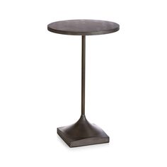 a round table with a metal base on an isolated white background for use as a side table