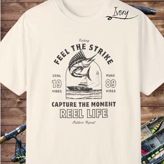 Saltwater jumping Marlin fishing tshirt, is the perfect casual cool comfort a fisherman needs day and night.  It's the perfect gift! Design prints on the front, however, feel free to message me for other requests.  Solid color tees are 100% ring spun cotton.  Choose from 4 different colors, white, ivory, blue jean, or pepper. It's the perfect gift for any "fisherman" for any occasion.   Description: ►Comfort Colors unisex high quality shirt ►100% US ring-spun cotton long lasting color ►Pre-shrun Casual Crew Neck Fishing T-shirt, Casual Pre-shrunk T-shirt For Fishing, Casual Crew Neck T-shirt For Fishing, Summer Fishing T-shirt With Crew Neck, Summer Crew Neck T-shirt For Fishing, Crew Neck T-shirt For Summer Fishing, Graphic Print Short Sleeve T-shirt For Fishing, Graphic Print Crew Neck T-shirt For Fishing, Graphic Tee T-shirt For Fishing