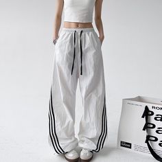 White Side Stripes Track Pants | Jennie - BlackPink White M White Sporty Pants With Three Stripes, Sporty White Pants With Contrast Stripes, Jennie Kim Pants, White Sporty Pants With Contrast Stripes, Vintage Track Pants White, Low Waisted Pants, Tie Waist Pants, Printed Sweatpants, Fashion Chingu