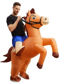 a man riding on the back of an inflatable horse with a harness around his neck