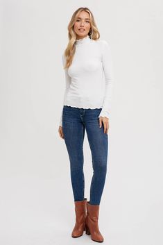 The ribbed knit lettuce-edge mock neck top is a chic and versatile piece that boasts a sleek, form-fitting silhouette. With its long sleeves and a neckline that hugs the neck in a stylish mock neck design, this top offers a blend of comfort and sophistication. The lettuce-edge detailing adds a touch of texture and flair to the hem, giving it a subtly playful and fashionable look. Its ribbed knit construction ensures a flattering fit while offering flexibility and ease of movement, making it an e Nursing Wear, School Collection, Mock Neck Top, Spring Collection, Baby Wearing, Mock Neck, Neck Designs, Plus Size Tops, Childrens Clothes