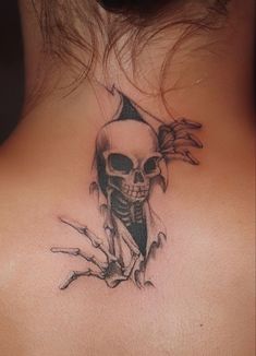 a woman's back neck with a skull on it