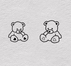 two teddy bears sitting next to each other on a white paper background with black ink