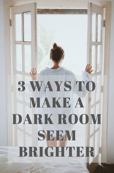 a woman standing in front of an open window with the words 3 ways to make a dark room seem brighter