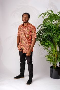 This soft and lightweight African print (Ankara)  men's shirt is perfect for summer. It is made of cotton and has a classic button down collar. The bright color will match with any outfit which makes it perfect for a night out on the town, a special occasion, casual wear or work.  The Shirt is named after the street style dance from Nigeria; Shoki Short sleeves  100% Ankara wax cotton (exclusive of ornamentation) One breast pocket  Patrick is 5'9" and wearing size XL Handmade in Nigeria Orange Cotton Summer Shirt, Relaxed Fit Orange Shirt For Summer, Summer Orange Cotton Shirt, Summer Orange Shirt With Relaxed Fit, Summer Orange Shirt Relaxed Fit, Orange Cotton Camp Shirt For Summer, Summer Orange Cotton Camp Shirt, Orange Cotton Hawaiian Shirt For Summer, Orange Relaxed Fit Hawaiian Shirt With Short Sleeves