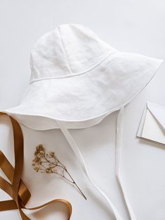 This floppy brim, white linen, spring, summer, or travel baby sunhat is made to keep the sun off your child's face in the summer sunshine. The perfect keepsake accessory for a spring wedding, family vacation, or as a beach hat. A thoughtful newborn baby gift for your new grandbaby or Mother's day, this sun protective hat comes in sizes for infants, babies, and toddlers. Handmade in Utah, USA by me. Size Chart: Please double check sizing before placing your order. (If you would like a little grow Newborn Sun Hat, New Grandbaby, Baby Sun Bonnet, Toddler Sun Hat, Happy Birthday Kids, Travel Baby, Grow Room, Baby Beach, Baby Sun Hat