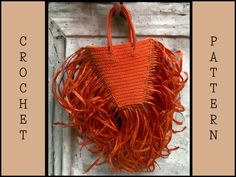 an orange handbag with fringes hanging from it's side and the words crochet pattern below