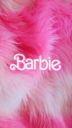 the word barbie is written in white on pink fur