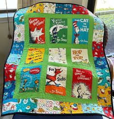 a child's quilt with dr seuss books on it