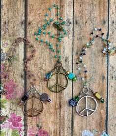 ❤ EveRy DaY WeaR ❤  This DESIGN ~ A Peace sign pendant along with an array of charms, beads & findings dangle from this 16" micro beaded chain. Necklace will be made with chain color as shown. Peace sign measures a little over 1.5" Select your choice of copper, brass or silver from the drop down menu! jewelry for your heart & soul <-----❤---- NOTE ❤ ---> The listing photos you are seeing are of my original designs. I only change the photos when there is a significant design difference. What this means is, you may receive: a necklace with a different type of bead/charm; a slight difference to the leather pattern; placement/style of rivets on the leather, size of glass bead chain etc. Bohemian Charm Necklaces With Round Beads For Gift, Bohemian Charm Necklace With Round Beads For Gift, Symbolic Beaded Necklaces For Jewelry Making, Hippie Style Round Beads Jewelry For Crafting, Hippie Style Colorful Beaded Jewelry For Gifts, Spiritual Adjustable Charm Necklaces Nickel Free, Bohemian Crystal Necklaces For Jewelry Making, Hippie Style Round Beads Jewelry Gift, Bohemian Necklace With Nickel Free Round Beads