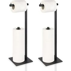 two black and white toilet paper holders with one roll on each side, the other is empty