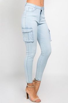 Try on this stylish perfect pair of light blue high waist skinny jeans with cargo pockets. Features cargo-style pockets. Zip fly gold button closure Side pockets Stretchy Fabric: 97% Cotton - 3% Spandex Inseam: 27" Rise: 12" Note: Item is pants ONLY. Nothing else is included. Trendy High Rise Light Wash Cargo Jeans, Fitted Utility Cargo Pants In Medium Wash, Mid-rise Light Wash Cargo Pants With Pockets, Spring Medium Wash Bottoms With Flap Pockets, Trendy Light Wash Mid-rise Cargo Jeans, Trendy High Rise Light Wash Cargo Pants, Trendy Blue Bottoms With Flap Pockets, Fitted High Waist Light Wash Cargo Jeans, High Waist Fitted Light Wash Cargo Jeans