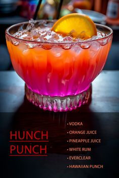 an orange and pink punch in a glass bowl