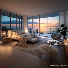 a bedroom with large windows overlooking the water at sunset or dawn, and an ottoman on the floor