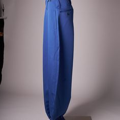 The Pants Are In Deadstock Condition With Tags Still Attached. Royal Shade Of Blue. There Are 2 Hip Pockets, A Small Front Pocket, 2 Button Back Pockets And Side Utility Pocket. Zipper At The Ankles Which Allows The Pants To Hang Over And Give A Wide Baggy Look. Measures 38 Cm Across Waist, 30 Cm Rise, 114 Cm Inseam Fitted Blue Pants With Hip Pockets, Fitted Blue Bottoms With Hip Pockets, Blue Tapered Leg Bottoms With Pockets, Blue Full-length Bottoms With Belt Loops, Blue Baggy Wide Leg Pants, Blue Baggy Bottoms With Hip Pockets, Blue Cargo Pants With Belt Loops For Spring, Blue Baggy Trousers, Blue Straight Leg Bottoms With Belt Loops