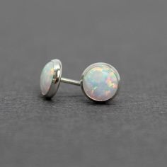 These opal stud earrings are beautiful.  They feature a single 6mm simulated opal cabochons.  Hand bezel set in my studio.  • 6mm Simulated Opal Round Cabochons• 14k Gold Filled or 925 Sterling SilverThey will arrive carefully packaged in a signature kraft gift box. Check out all of my opal earrings: https://www.etsy.com/shop/KMBankston/search?search_query=opal+earring&order=date_desc&view_type=gallery&ref=shop_search~About Me:My name is Kathy Bankston, and I am a metalsmith and lamp Classic Opal Jewelry As A Gift, Classic Opal Jewelry For Gifts, Nickel Free Elegant Opal Ring, Elegant Nickel Free Opal Ring, Classic Opal Birthstone Jewelry, Opal Jewelry With Matching Earrings For Anniversary, Dainty Round Cabochon Jewelry, Dainty Round Opal Jewelry, Pink Opal Jewelry For Anniversary