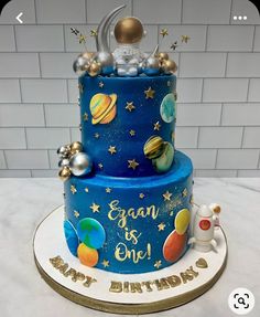 a birthday cake with an image of the moon and planets on it's side