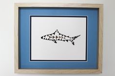 a drawing of a shark is hanging on the wall