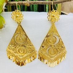 Beautiful and stunning handmade Mexican Filigree Earrings. Each piece is meticulously created out of copper wire and spun into a beautiful design. To give it the final touch artisans dipped into gold plate for it's gold color. This accessory is an important part of the traditional Tehuana outfit from Oaxaca, Mexico. Look elegant while wearing Mexico's culture with this one of a kind earrings! Approximate length: 3.5 - 4 in Traditional Nickel-free Teardrop Earrings As A Gift, Traditional Nickel-free Teardrop Earrings For Gift, Filigree Chandelier Drop Earrings For Festivals, Traditional Bridal Drop Earrings, Traditional Pierced Hoop Earrings For Celebration, Traditional Pierced Bridal Drop Earrings, Festive Chandelier Drop Earrings, Festive Pierced Chandelier Drop Earrings, Artisan Filigree Jewelry For Festivals