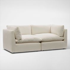 Pillowy soft with a modern style. The Lola 2-Piece Sofa elevates your space with minimalist detailing, cloud-like comfort and oversized seating you just want to burrow in. | Lola 2-Piece Sofa in Ivory | by Value City Furniture Large White Sofa, White Sofa Living Room Modern, White Sofa Living Room, White Sofa, American Signature Furniture, Value City Furniture, White Sofas, Sofa Living, City Furniture