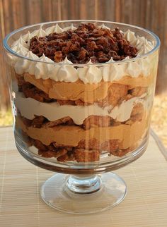 a layered dessert in a glass dish on a table