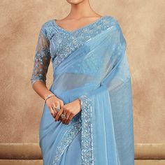 Sky Blue colored saree is prettified with sequins floral embroidered work as shown which makes it appear classy. This saree is made of chiffon silk fabric which is accompanied with banglori silk & net blouse piece which you can customise as per your design/style. Women can buy this saree to wear for their parties, reception and events. Note:- The actual product may differ slightly in color and design from the one illustrated in the images when compared with computer or mobile screen. Measurements: Saree : Chiffon : 5.5 Mtrs Blouse : Chiffon : 0.8 Mtr Material: Chiffon Stitch Type: Unstitched Country of Origin: India Care Guide: Dry Clean Embroidery Stones, Sky Blue Saree, Saree Chiffon, Sky Blue Weddings, Blouse Chiffon, Net Blouse, Resham Embroidery, Wedding Party Wear, Net Blouses