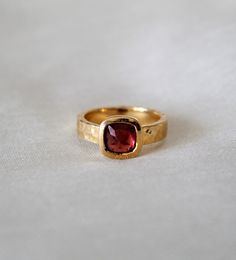 D E T A I L S - Stone: Garnet Stone Shape: Pyramid Material: Sterling silver The fit: True to US ring size Finish: Hammered and Gold Plated to a high shine S H I P P I N G & P R O D U C T I O N - My current production time is 2-6 business days, which means after those days are up, your order ships! I make everything custom to order, by hand, but I promise you it's worth the wait! R U S H - M Y - O R D E R - If you're in a rush to get your pretty new pieces, please send me a message and I'll Blue Topaz Ring For Gift, Heirloom Topaz Ring With Bezel Setting For Gift, Heirloom Style Topaz Ring With Bezel Setting As Gift, Heirloom Style Topaz Ring With Bezel Setting, Sally Mcqueen, Garnet Birthstone Rings, Etsy Rings, Vintage Garnet Ring, Garnet Ring Gold