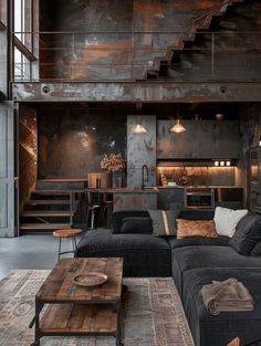 a living room filled with furniture next to a stair case and wooden flooring on the walls