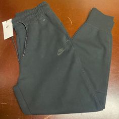 Nike Womens Black Sportswear Tech Fleece High Rise Standard Fit Jogger Pants Brand: Nike Department: Women Size: M, Xl, Xxl Color: Black Type: Pants Style: Jogger Pattern: Solid Theme: Sports Occasion: Activewear Season: All Season Features: Elastic Waist, Zipped Pockets Condition: New With Tags I Offer Discounts For All Return Customers. - Jvs Jogger Pattern, Athleisure Pants, Nike Sportswear Women, Black Jogger Pants, Black Sportswear, Nike Sweats, Black Windbreaker, Fitted Joggers, Fleece Sweatpants