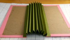 folded paper on top of a cutting mat