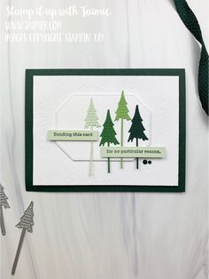 a handmade christmas card with trees on it and the words stamping this card